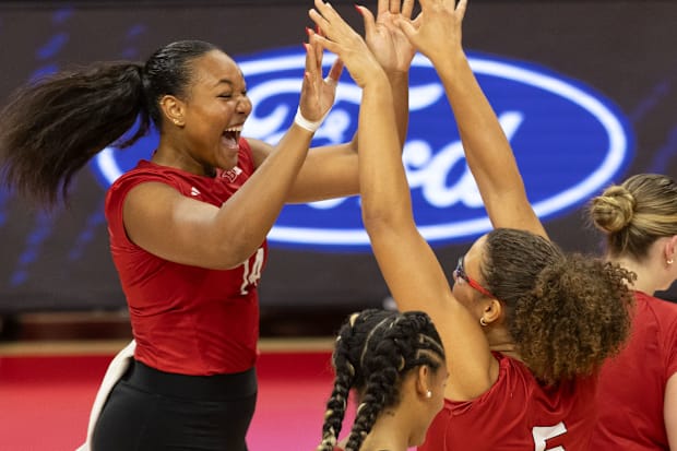 Nebraska middle blocker Manaia Ogbechie celebrates with middle blocker Rebekah Allick during the Red-White Scrimmage.