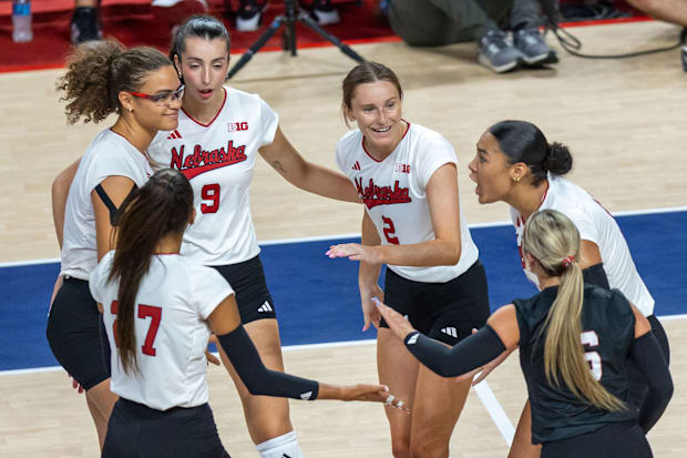 Members of the Husker Volleyball team celebrate after a point during the second set vs. Pittsburgh.
