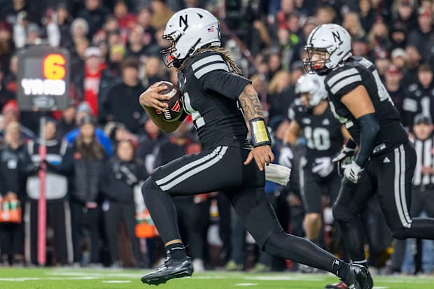 Nebraska quarterback TJ Lateef runs with the ball against USC.