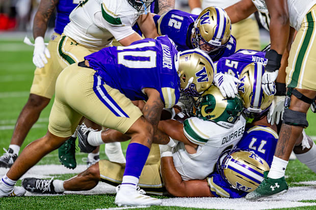 Simote Pepa (77) and Xe'ree Alexander (10) bring down Jalen Dupree of Colorado State. 