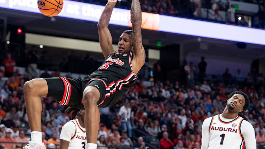 Houston center Chris Cenac dunks the ball against Auburn.