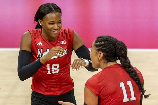 Nebraska opposite hitter Ryan Hunter celebrates with outside hitter Teraya Sigler during the Red-White Scrimmage on Saturday.