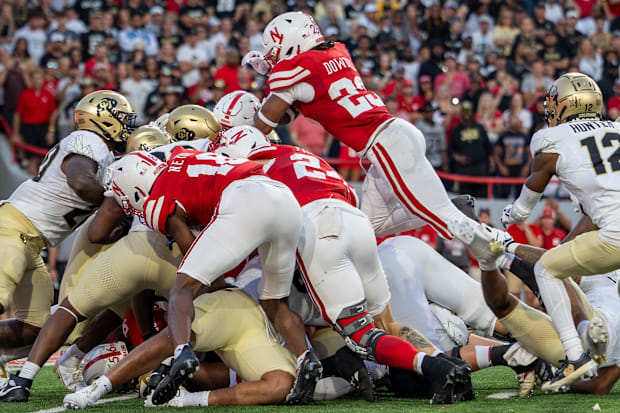 Nebraska running back Dante Dowdell leaps over the pile to score on a 1-yard touchdown in the second quarter against Colorado