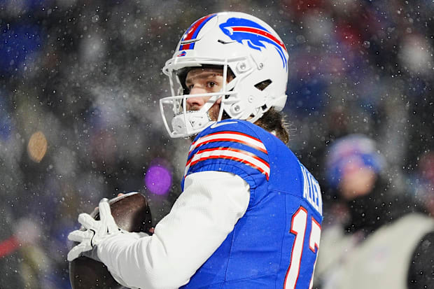 Josh Allen warms up in the snow
