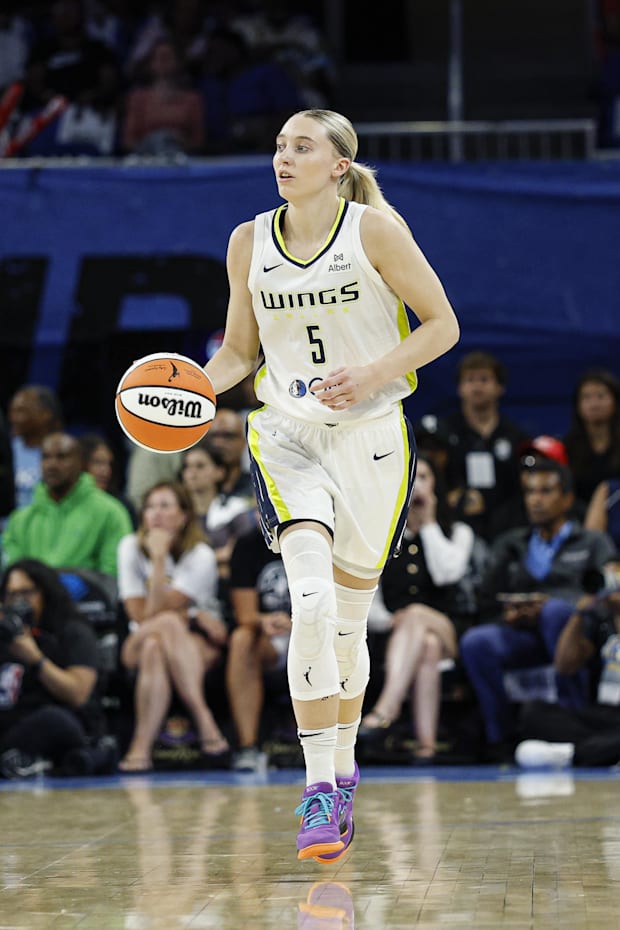 Dallas Wings guard Paige Bueckers brings the ball up court against the Chicago Sky