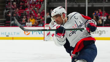 Apr 5, 2024; Raleigh, North Carolina, USA; Washington Capitals left wing Alex Ovechkin (8) takes a shot against the Carolina Hurricanes during the second period at PNC Arena. Mandatory Credit: James Guillory-USA TODAY Sports