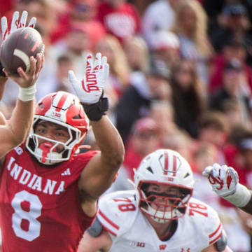 Indiana's Stephen Daly (8) pressures Wisconsin's Carter Smith (5) during the Indiana versus Wiscsonsin football game at Memorial Stadium on Saturday, Nov. 15, 2025.