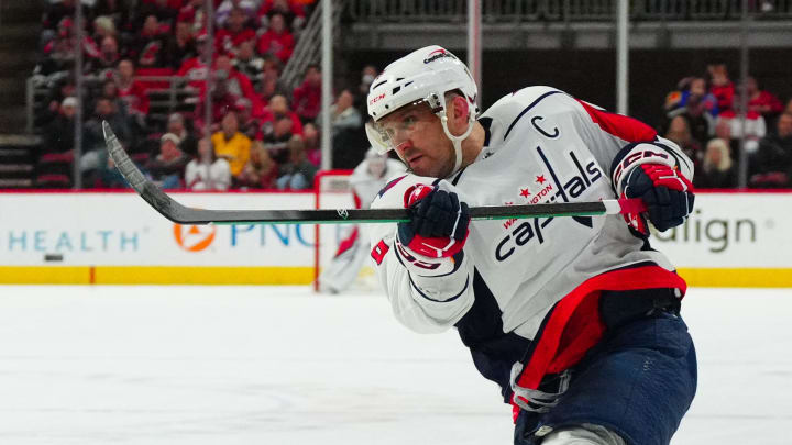 Apr 5, 2024; Raleigh, North Carolina, USA; Washington Capitals left wing Alex Ovechkin (8) takes a shot against the Carolina Hurricanes during the second period at PNC Arena. Mandatory Credit: James Guillory-USA TODAY Sports