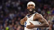 Apr 12, 2022; Minneapolis, Minnesota, USA;  Minnesota Timberwolves guard Patrick Beverley (22) pounds on his heart as he riles up the crowd during the fourth quarter of a play-in game against the Los Angeles Clippers at Target Center. Mandatory Credit: Nick Wosika-Imagn Images