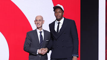 Jun 25, 2025; Brooklyn, NY, USA;  Derik Queen stands with NBA commissioner Adam Silver after being selected as the 13th pick by the Atlanta Hawks in the first round of the 2025 NBA Draft at Barclays Center. Mandatory Credit: Brad Penner-Imagn Images