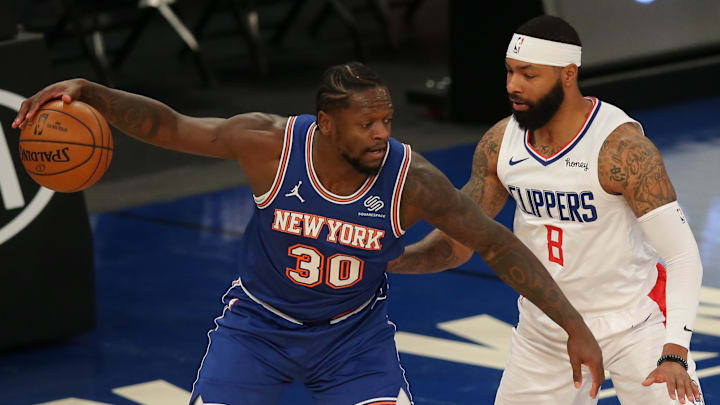 Jan 31, 2021; New York, New York, USA; New York Knicks power forward Julius Randle (30) controls the ball against LA Clippers small forward Marcus Morris Sr. (8) during the first quarter at Madison Square Garden. Mandatory Credit: Brad Penner-Imagn Images