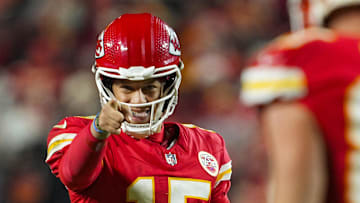 Dec 8, 2024; Kansas City, Missouri, USA; Kansas City Chiefs quarterback Patrick Mahomes (15) points to tight end Travis Kelce (87) after a play during the second half against the Los Angeles Chargers at GEHA Field at Arrowhead Stadium. Mandatory Credit: Jay Biggerstaff-Imagn Images