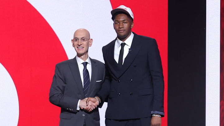 Derik Queen stands with NBA commissioner Adam Silver after being selected as the 13th pick of the 2025 NBA Draft.