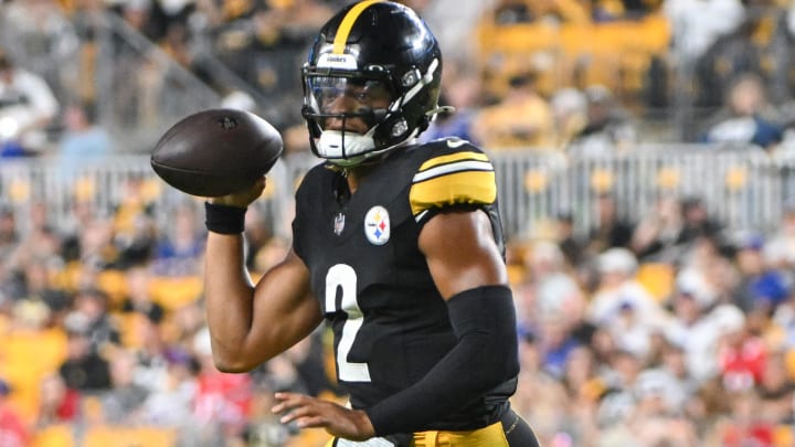 Aug 17, 2024; Pittsburgh, Pennsylvania, USA;  Pittsburgh Steelers quarterback Justin Fields (2) scrambles against the Buffalo Bills during the third quarter at Acrisure Stadium.