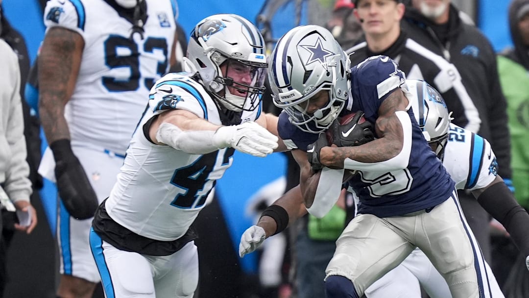 Dec 15, 2024; Charlotte, North Carolina, USA; Dallas Cowboys wide receiver KaVontae Turpin (9) is tackled after a catch by Carolina Panthers linebacker Josey Jewell (47) during the second half at Bank of America Stadium. Mandatory Credit: Jim Dedmon-Imagn Images