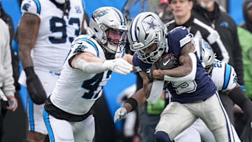 Dec 15, 2024; Charlotte, North Carolina, USA; Dallas Cowboys wide receiver KaVontae Turpin (9) is tackled after a catch by Carolina Panthers linebacker Josey Jewell (47) during the second half at Bank of America Stadium. Mandatory Credit: Jim Dedmon-Imagn Images