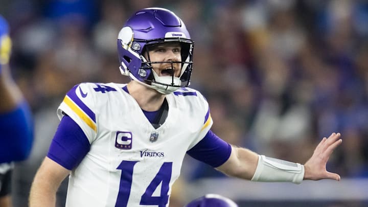 Jan 13, 2025; Glendale, AZ, USA; Minnesota Vikings quarterback Sam Darnold (14) reacts as he calls a play against the Los Angeles Rams during an NFC wild card game at State Farm Stadium.