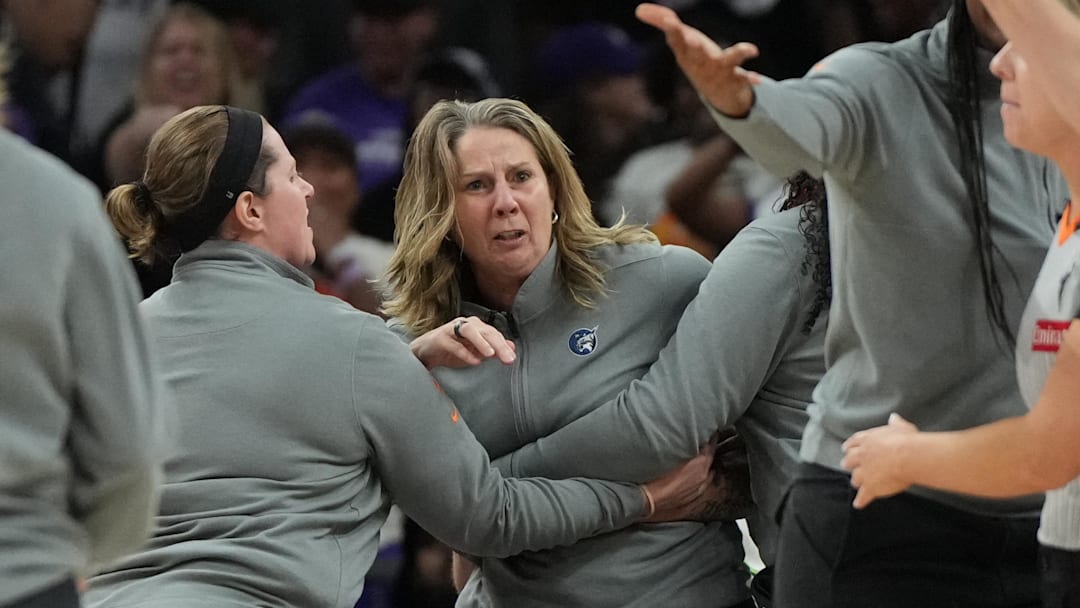 Sep 26, 2025; Phoenix, Arizona, USA; Minnesota Lynx head coach Cheryl Reeve is held back after being ejected during game three against the Phoenix Mercury of the second round for the 2025 WNBA Playoffs at PHX Arena. Mandatory Credit: Rick Scuteri-Imagn Images