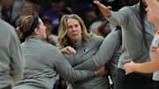 Sep 26, 2025; Phoenix, Arizona, USA; Minnesota Lynx head coach Cheryl Reeve is held back after being ejected during game three against the Phoenix Mercury of the second round for the 2025 WNBA Playoffs at PHX Arena. Mandatory Credit: Rick Scuteri-Imagn Images