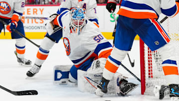 Dec 17, 2024; Raleigh, North Carolina, USA;  New York Islanders goaltender Marcus Hogberg (50) makes a save against the Carolina Hurricanes during the third period at Lenovo Center. Mandatory Credit: James Guillory-Imagn Images