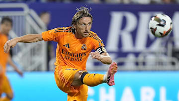 Aug 6, 2024; Charlotte, NC, USA; Real Madrid midfielder Luka Modric (10) kicks the ball up field against Chelsea during the second half at Bank of America Stadium. Mandatory Credit: Jim Dedmon-Imagn Images