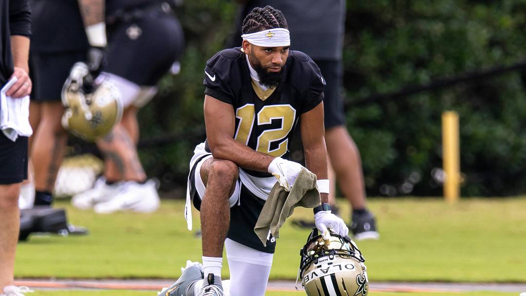 Jun 10, 2025; New Orleans, LA, USA;  New Orleans Saints wide receiver Chris Olave (12) looks on during minicamp at Ochsner Sports Performance Center. Mandatory Credit: Stephen Lew-Imagn Images