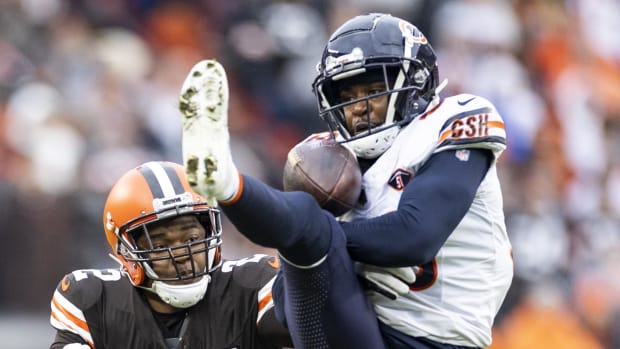 Chicago Bears cornerback Jaylon Johnson (33) breaks up a pass intended for Cleveland Browns wide receiver Amari Cooper.