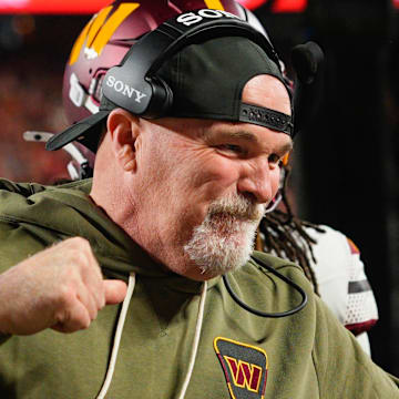 Washington Commanders head coach Dan Quinn celebrates an interception against the Kansas City Chiefs.
