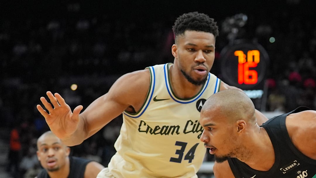 San Antonio Spurs forward/center Victor Wembanyama dribbles against Milwaukee Bucks forward Giannis Antetokounmpo.