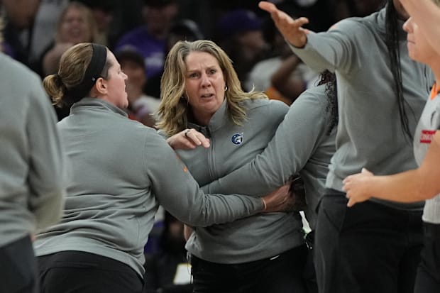 Lynx head coach Cheryl Reeve is held back after being ejected during game three against the Phoenix Mercury