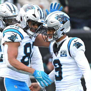 Dec 8, 2024; Philadelphia, Pennsylvania, USA; Carolina Panthers tight end Tommy Tremble (82) celebrates his touchdown catch with quarterback Bryce Young (9) against the Philadelphia Eagles during the second quarter at Lincoln Financial Field. Mandatory Credit: Eric Hartline-Imagn Images