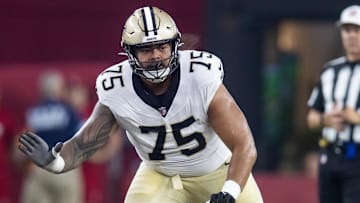 Aug 10, 2024; Glendale, Arizona, USA; New Orleans Saints  offensive tackle Taliese Fuaga (75) against the Arizona Cardinals during a preseason NFL game at State Farm Stadium. Mandatory Credit: Mark J. Rebilas-Imagn Images
