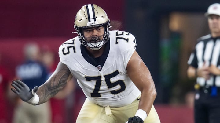 Aug 10, 2024; Glendale, Arizona, USA; New Orleans Saints  offensive tackle Taliese Fuaga (75) against the Arizona Cardinals during a preseason NFL game at State Farm Stadium. Mandatory Credit: Mark J. Rebilas-Imagn Images