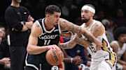 Dec 6, 2025; Brooklyn, New York, USA; Brooklyn Nets forward Michael Porter Jr. (17) is guarded by New Orleans Pelicans guard Jose Alvarado (15) during the first half at Barclays Center. Mandatory Credit: Vincent Carchietta-Imagn Images