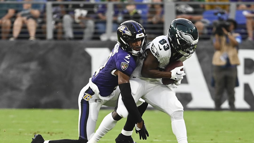 Aug 9, 2024; Baltimore, Maryland, USA;  Philadelphia Eagles wide receiver John Ross (83) makes catch in front of Baltimore Ravens cornerback Nate Wiggins (2) during the first  quarter of a preseason game at M&T Bank Stadium. Mandatory Credit: Tommy Gilligan-Imagn Images