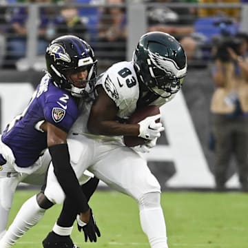 Aug 9, 2024; Baltimore, Maryland, USA;  Philadelphia Eagles wide receiver John Ross (83) makes catch in front of Baltimore Ravens cornerback Nate Wiggins (2) during the first  quarter of a preseason game at M&T Bank Stadium. Mandatory Credit: Tommy Gilligan-Imagn Images