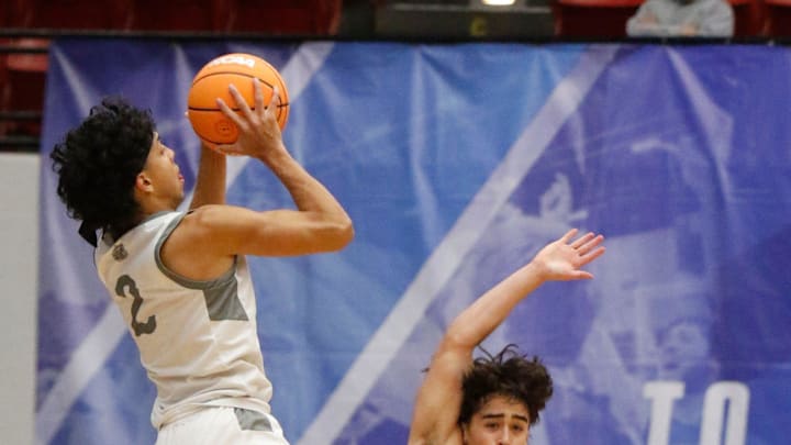 Riviera Preps #2 Mason Fuentes shoots drawing a foul from Hawks #3 Cyrus Nofallah during the second half, Riviera Prep defeated Santa Fe Catholic 66 -54 to win the FHSAA 2A State Boys basketball Championship game at the RP Funding Center in Lakeland Fl. February 28th 2025. Photos special to the Ledger / Calvin Knight Riviera Preps #2 Mason Fuentes shoots drawing a foul from Hawks #3 Cyrus Nofallah during the second half, Riviera Prep defeated Santa Fe Catholic 66 -54 to win the FHSAA 2A State Boys basketball Championship game at the RP Funding Center in Lakeland Fl. February 28th 2025. Photos special to the Ledger / Calvin Knight