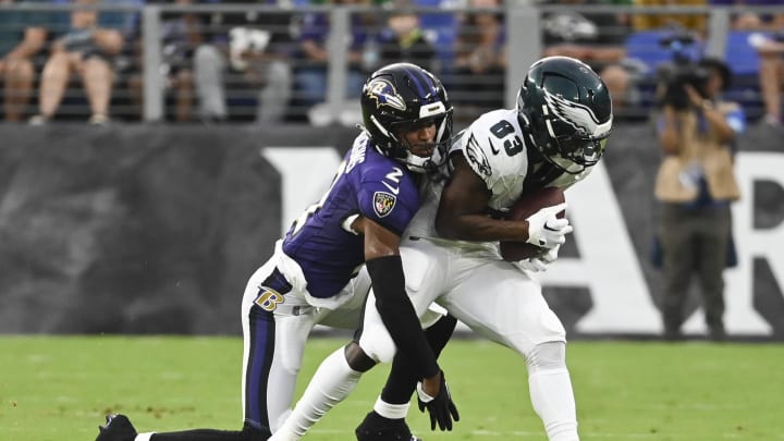 Aug 9, 2024; Baltimore, Maryland, USA;  Philadelphia Eagles wide receiver John Ross (83) makes catch in front of Baltimore Ravens cornerback Nate Wiggins (2) during the first  quarter of a preseason game at M&T Bank Stadium. Mandatory Credit: Tommy Gilligan-USA TODAY Sports