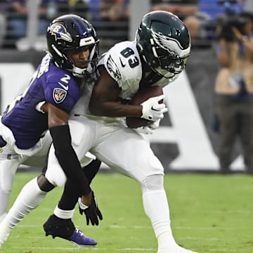 Aug 9, 2024; Baltimore, Maryland, USA;  Philadelphia Eagles wide receiver John Ross (83) makes catch in front of Baltimore Ravens cornerback Nate Wiggins (2) during the first  quarter of a preseason game at M&T Bank Stadium. Mandatory Credit: Tommy Gilligan-Imagn Images