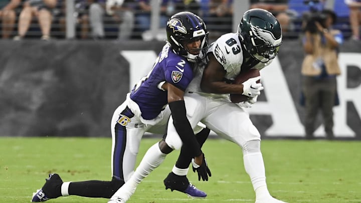 Aug 9, 2024; Baltimore, Maryland, USA;  Philadelphia Eagles wide receiver John Ross (83) makes catch in front of Baltimore Ravens cornerback Nate Wiggins (2) during the first  quarter of a preseason game at M&T Bank Stadium. Mandatory Credit: Tommy Gilligan-Imagn Images