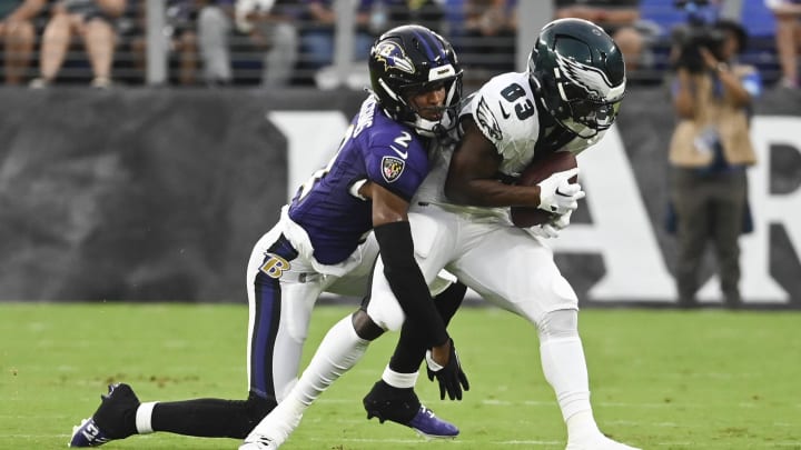 Aug 9, 2024; Baltimore, Maryland, USA;  Philadelphia Eagles wide receiver John Ross (83) makes catch in front of Baltimore Ravens cornerback Nate Wiggins (2) during the first  quarter of a preseason game at M&T Bank Stadium. Mandatory Credit: Tommy Gilligan-USA TODAY Sports