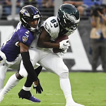 Aug 9, 2024; Baltimore, Maryland, USA;  Philadelphia Eagles wide receiver John Ross (83) makes catch in front of Baltimore Ravens cornerback Nate Wiggins (2) during the first  quarter of a preseason game at M&T Bank Stadium. Mandatory Credit: Tommy Gilligan-Imagn Images