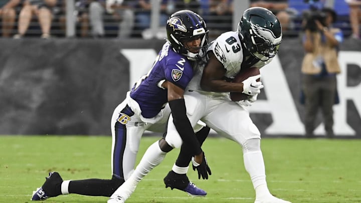 Aug 9, 2024; Baltimore, Maryland, USA;  Philadelphia Eagles wide receiver John Ross (83) makes catch in front of Baltimore Ravens cornerback Nate Wiggins (2) during the first  quarter of a preseason game at M&T Bank Stadium. Mandatory Credit: Tommy Gilligan-Imagn Images