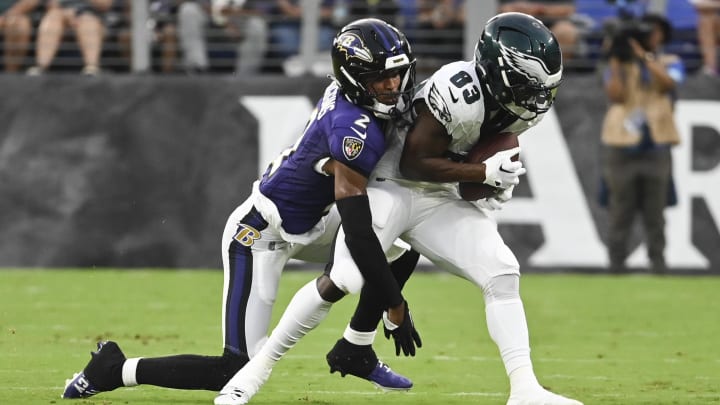 Aug 9, 2024; Baltimore, Maryland, USA; Philadelphia Eagles wide receiver John Ross (83) makes catch in front of Baltimore Ravens cornerback Nate Wiggins (2) during the first quarter of a preseason game at M&T Bank Stadium. Mandatory Credit: Tommy Gilligan-USA TODAY Sports