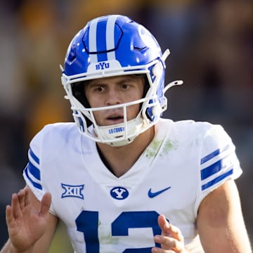 Nov 23, 2024; Tempe, Arizona, USA; Brigham Young Cougars quarterback Jake Retzlaff (12) against the Arizona State Sun Devils at Mountain America Stadium. Mandatory Credit: Mark J. Rebilas-Imagn Images