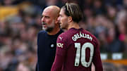 Pep Guardiola (left) has used Jack Grealish sparingly