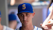Seattle Mariners starting pitcher George Kirby (68) is congratulated by teammates in the dugout during a game against the Pittsburgh Pirates at T-Mobile Park on July 6. 