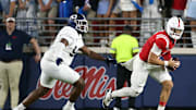 Sep 21, 2024; Oxford, Mississippi, USA; Mississippi Rebels quarterback Jaxson Dart (2) runs the ball as Georgia Southern Eagles defensive linemen Troy Pikes (93) pursues during the first half at Vaught-Hemingway Stadium. Mandatory Credit: Petre Thomas-Imagn Images