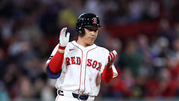 Sep 10, 2024; Boston, Massachusetts, USA; Boston Red Sox designated hitter Masataka Yoshida (7) reacts after hitting an RBI double during the eighth inning against the Baltimore Orioles at Fenway Park.