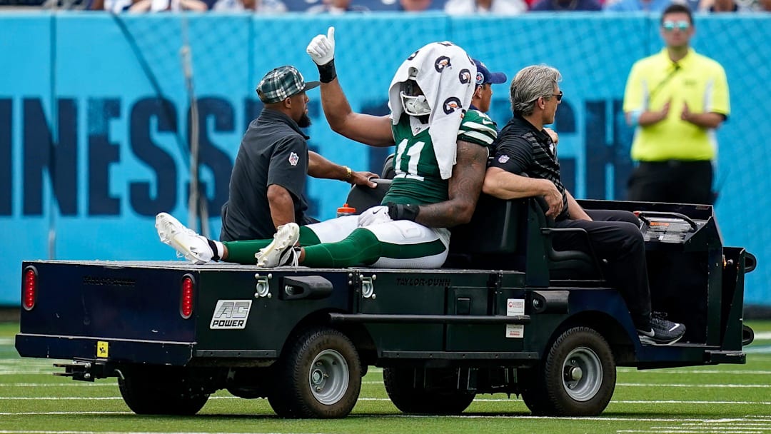 New York Jets linebacker Jermaine Johnson (11) exits the field after an injury during the third quarter against the Tennessee Titans at Nissan Stadium in Nashville, Tenn., Sunday, Sept. 15, 2024.